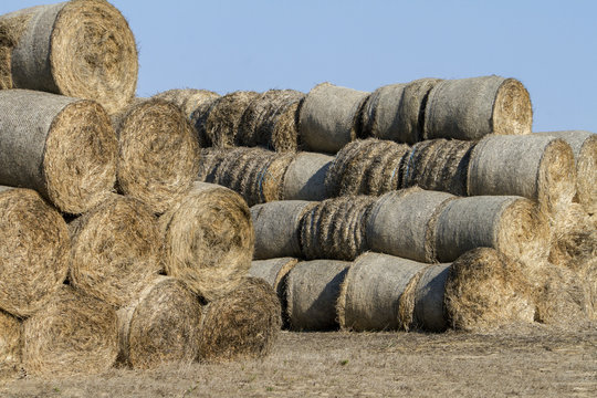 View of a stack of hay bales on the countryside.