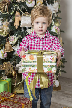 Young boy gives Christmas gift