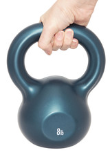 A hand holding a kettle bell