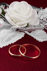 Wedding rings on a red cloth