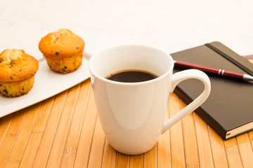 Vanilla with chocolate chips Muffins with a cup of coffee