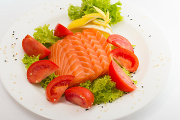 Raw salmon fillet with vegetables