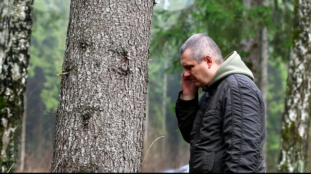 Depressed man leaning on a tree episode 3