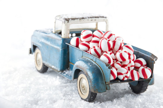 Toy truck carrying striped peppermint candy