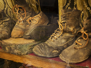 old leather shoes in old Italian shoe repair window