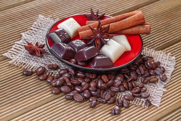 White and dark chocolate on a wooden background