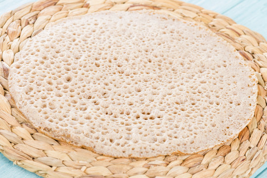 Injera - Ethiopian sourdough flatbread made with teff flour.