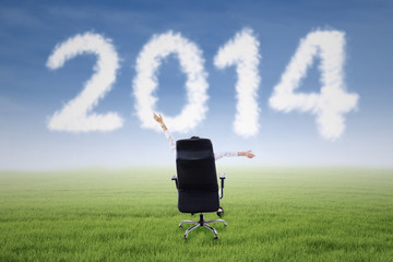 Successful businesswoman with 2014 cloud