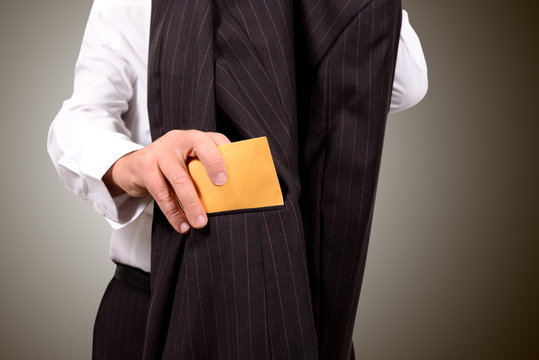 bribe in his pocket