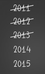 2011, 2012, 2013 crossed and new years 2014, 2015 on chalkboard