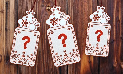 three christmas cards with question sticker