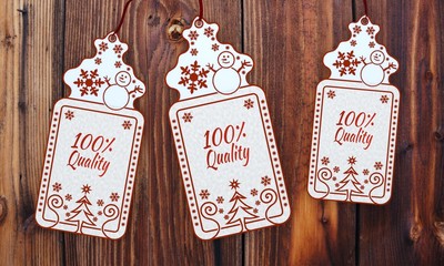 three christmas cards with quality sign