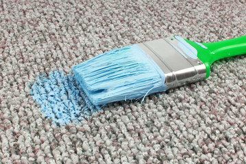 stained carpet with paint brush