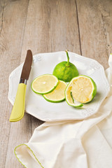 Lemon on plate on wooden table
