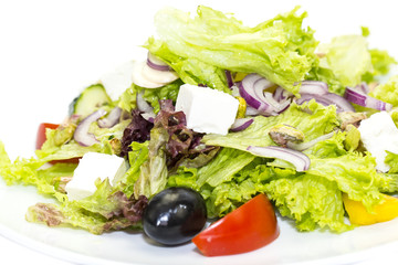 Greek salad on a white background in the restaurant
