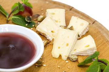 cheese plate, with several kinds of cheese on a white background