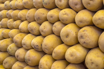 Fresh organic young potatoes sold on market