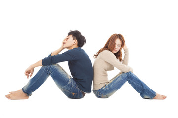 young Couple sitting back to back  during  conflict