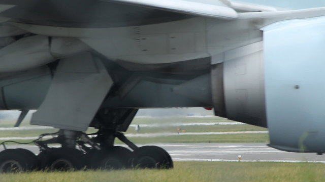 Commercial airliner taxiing on the tarmac. Detail of body and undercarriage. Pearson International Airport, Toronto, Ontario, Canada.
