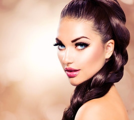 Hair Braid. Beautiful Woman with Healthy Long Brown Hair