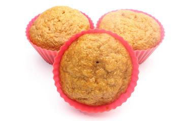 Fresh baked carrot muffins in red silicone cups