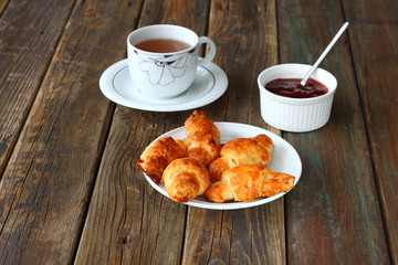 Breakfast with tea homemade croissants and jam