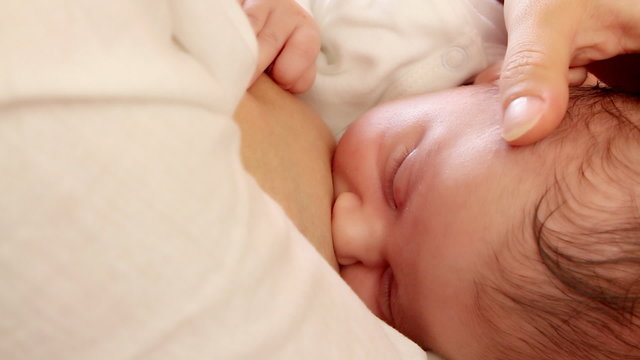Mother nursing baby