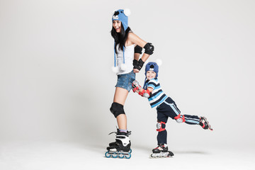 Fototapeta na wymiar Mother and son in roller skates