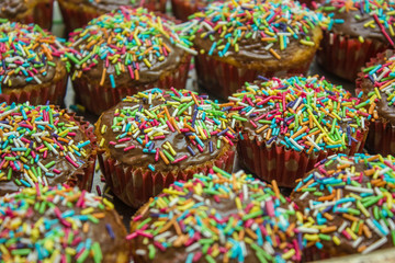 Fototapeta na wymiar Cupcakes with sprinkles