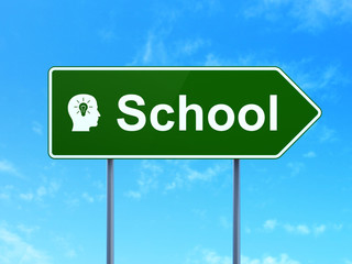 Education concept: School and Head With Light Bulb on sign