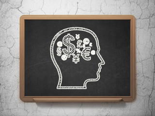 Education concept: Head With Finance Symbol on chalkboard