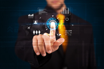 Handsome businessman touching future web technology buttons and