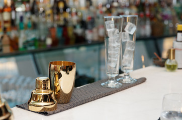 Bartender tools on bar counter, copy space