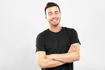 Smiling guy with crossed arms