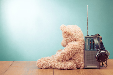 Retro toy Teddy Bear, radio receiver, headphones