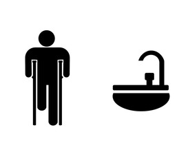Homme handicapé à coté d'un lavabo