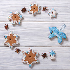 Christmas gingerbread star and blue horse on the table