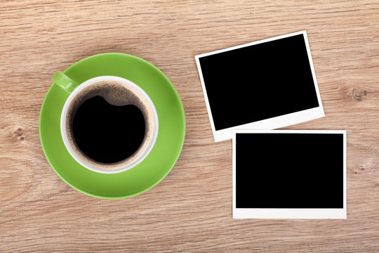 Cup of coffee and two photo frames