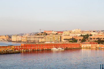 Fototapeta na wymiar Colorful Buldings in Port of Naples at Dawn