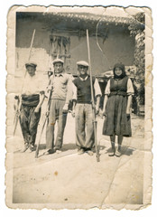 Fototapeta na wymiar CIRCA 1930 - Villagers in front of house