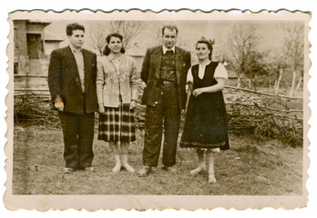 CIRCA 1955: Pairs posing a village backyard - 58681005