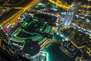 Dubai downtown night scene with city lights,