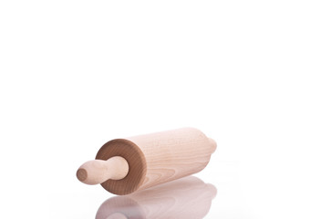 Wooden rolling pin on white background