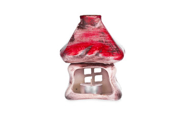 Clay house shaped candlestick isolated