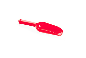 Red plastic transfer scoop used in cooking, isolated on white