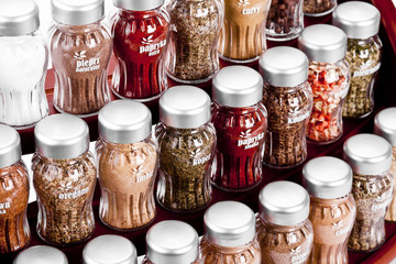  spice rack full of a variety of different spices and herb 