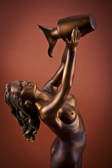 Woman Sculpture on brown background