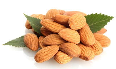 tasty almonds nuts with leaves, isolated on white