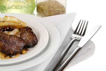 Appetizing fried chicken livers on plate isolated on white
