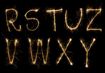 Shiny alphabet isolated on black